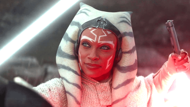 Rosario Dawson asAhsoka Tano holding a pair of sabers in The Acolyte