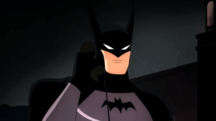 Batman holding a telephone in Batman: Caped Crusader.