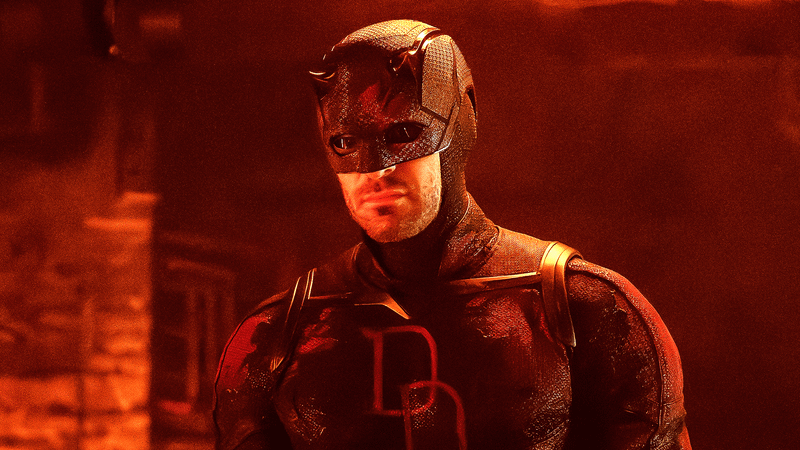 Charlie Cox Daredevil in black suit with red lighting in Born Again Season 2.