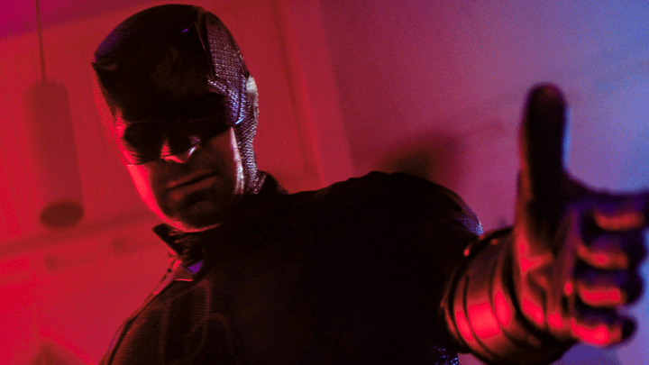 Charlie Cox as Daredevil extending his hand.