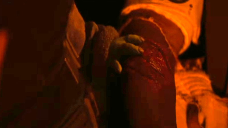 Grogu using Force healing on Greef Karga.