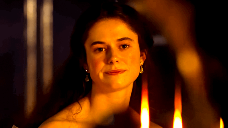 Isabella Linton by candles in 2026 Wuthering Heights movie.