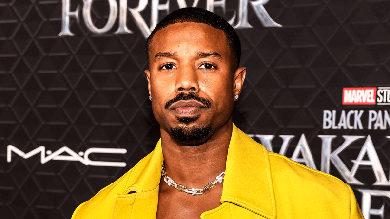 Michael B. Jordan in a yellow jacket at the premiere of 'Black Panther: Wakanda Forever.'