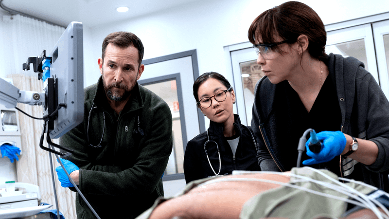 Noah Wyle as Dr. Robby, Irene Choi as Joy Kwon, Fiona Dourif as Dr. McKay in The Pitt.