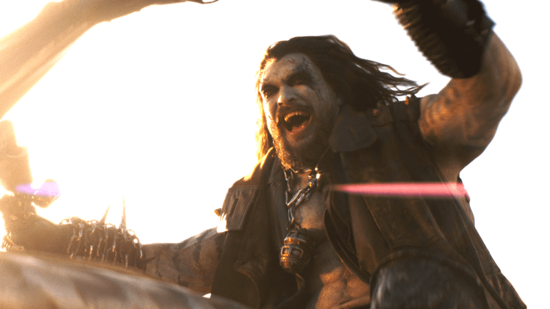 Jason Momoa as Lobo laughing and riding a bike in 'Supergirl.'