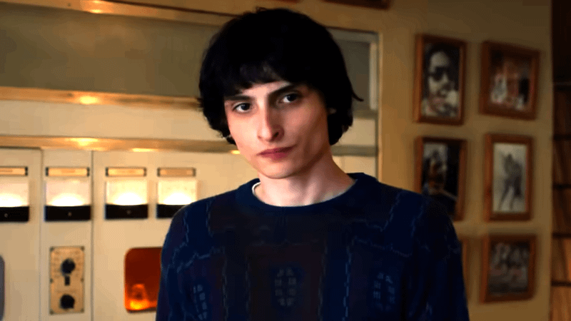 Finn Wolfhard as Mike Wheeler in a hospital room in Stranger Things