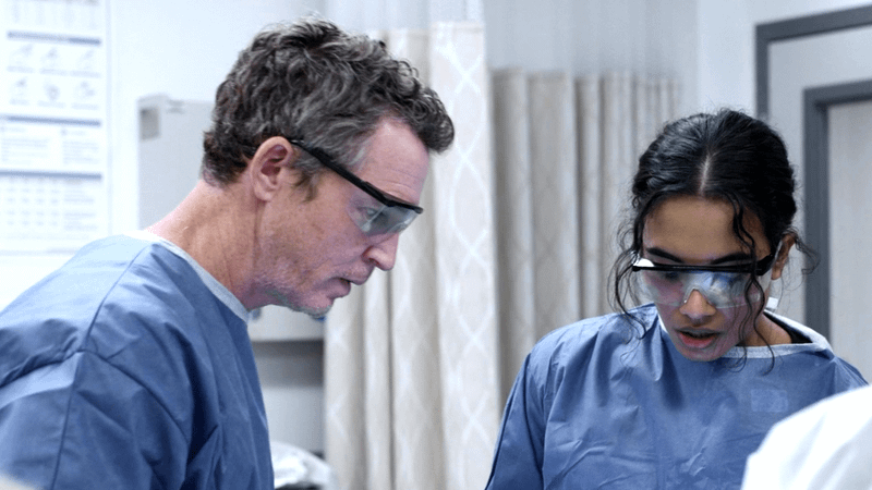 Shawn Hatosy as Dr. Jack Abbot & Supriya Ganesh as Dr. Mohan in The Pitt Season 1, Episode 14.