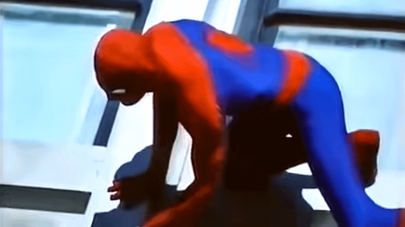 Nicholas Hammond's Spider-Man crawling on the wall.