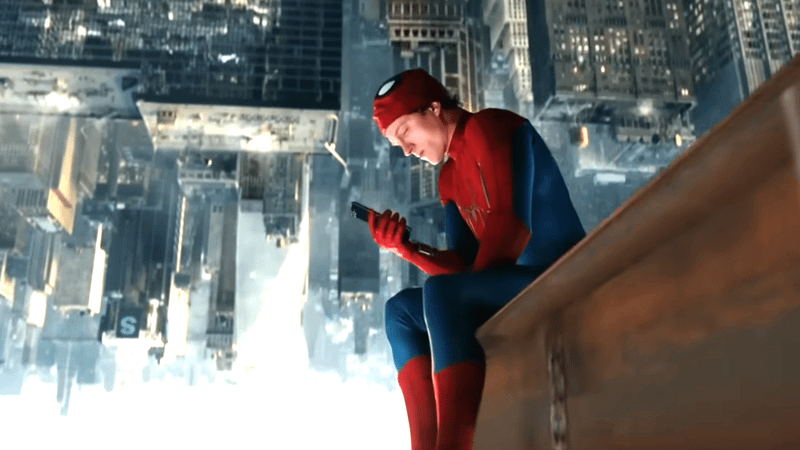 Spider-Man upside down on his phone.