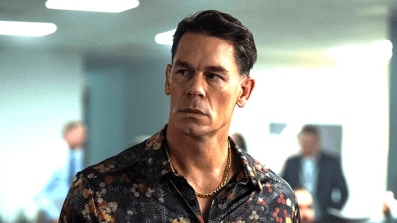 John Cena as Christopher Smith looking over his shoulder in Peacemaker