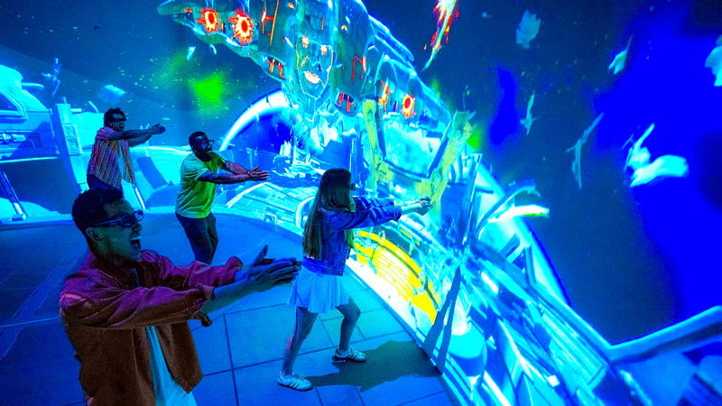 Fans playing in the Superman Experience.