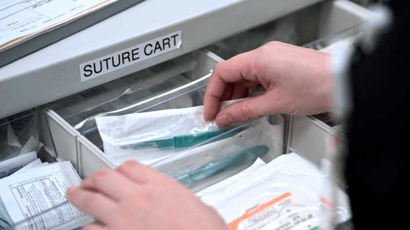 Santos stealing a scalpel inside a Suture Cart in The Pitt Season 2, Episode 12.