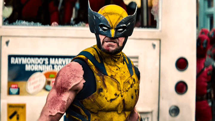 Hugh Jackman as Wolverine in his classic, yellow and black Wolverine costume with white eyes.