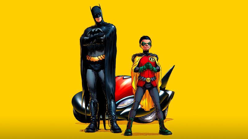 Batman and Robin standing next to one another in DC Comics