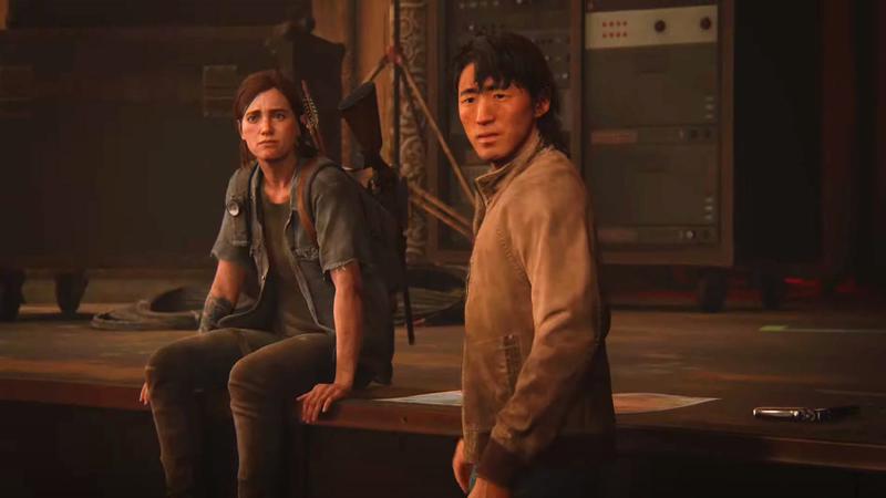 Ellie and Jesse standing in a theater in The Last of Us Part II