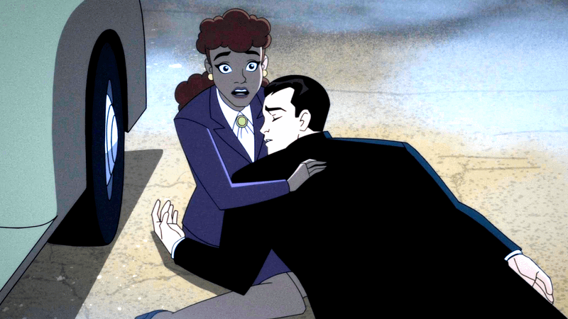 Barbara Gordon holding Harvey Dent's dead body.