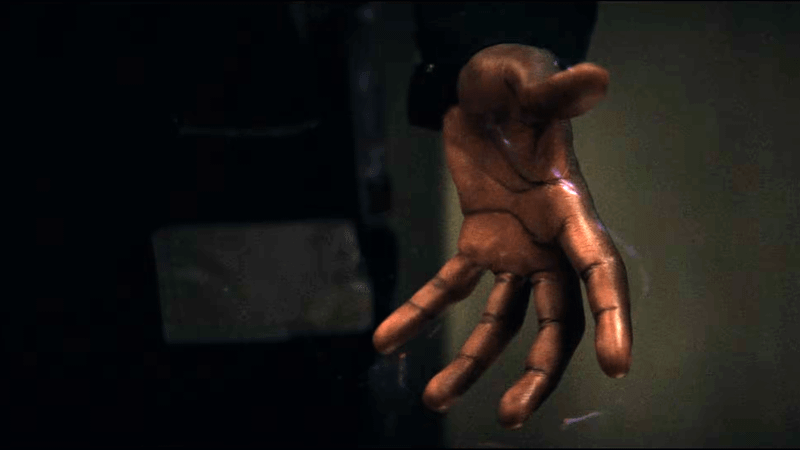 A subtle energy field surrounds Simon's hand in Wonder Man