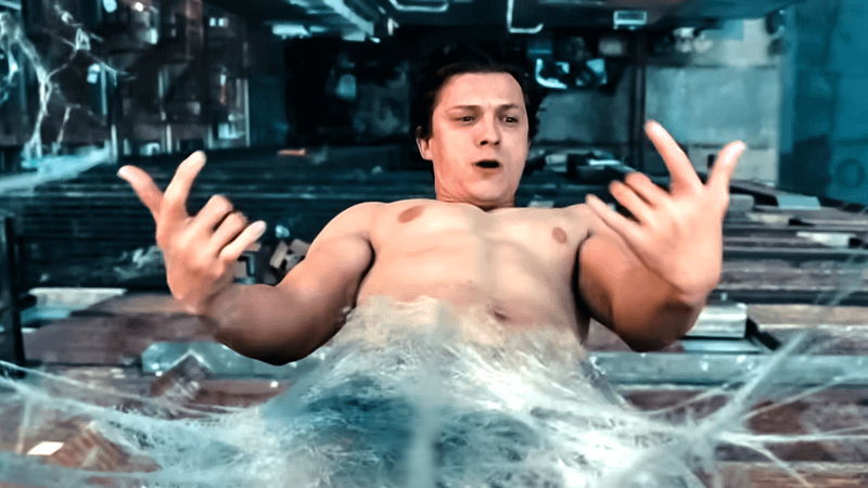 Peter Parker hanging from his own webbing outside of his apartment.