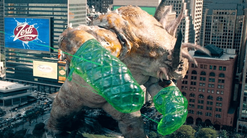 Green Lantern, Guy Gardner restrains kaiju with oven gloves.