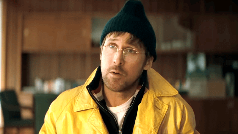 Ryan Gosling as Ryland Grace in a black beanie and yellow jacket in Project Hail Mary
