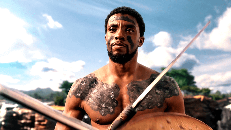 Chadwick Boseman as TChalla topless with spear.