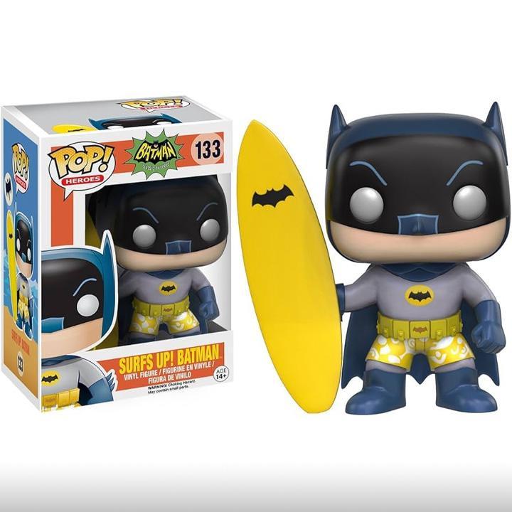 Surfs Up Batman Funko standing with a surfboard.