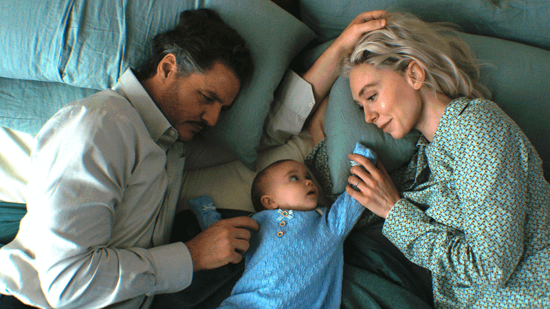 Pedro Pascal as Reed Richards, Franklin Richards as a baby, and Vanessa Kirby as Sue Storm in The Fantastic Four: First Steps