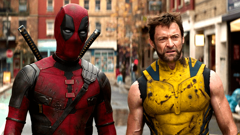 Deadpool and Wolverine standing in the street in the 2024 movie.