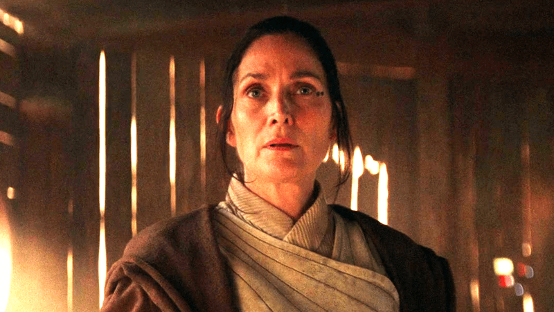 Carrie-Anne Moss as Indara looking worried in Jedi robes in The Acolyte