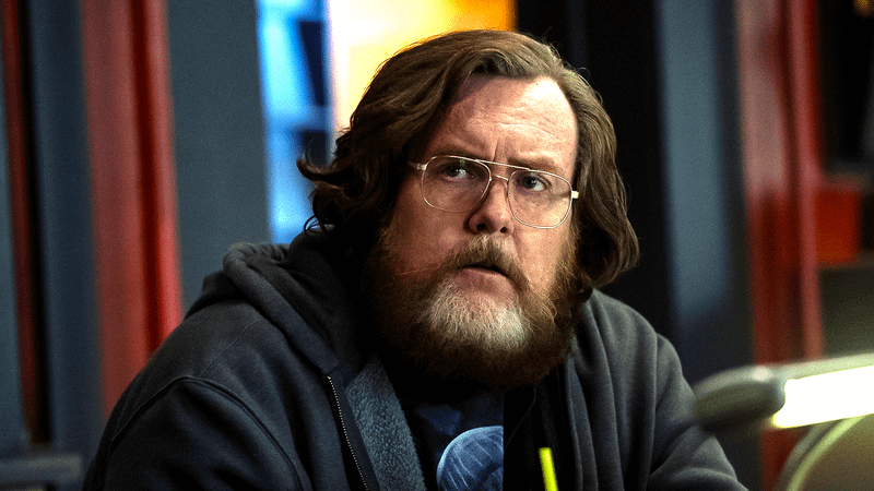 Steve Agee as John Economos in Peacemaker