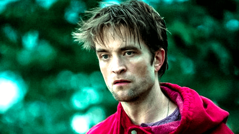 Robert Pattinson as Edward Cullen in a red sweater in Twilight