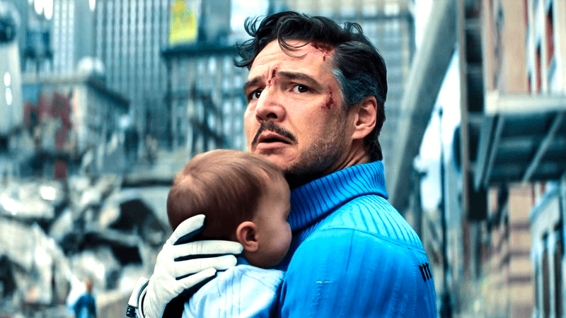 Reed Richards cradles his baby son Franklin during the battle with Galactus in The Fantastic Four: First Steps.