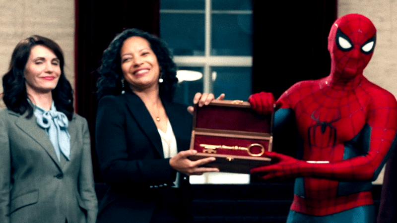 Sheila Rivera handing Spider-Man the Key to the City.