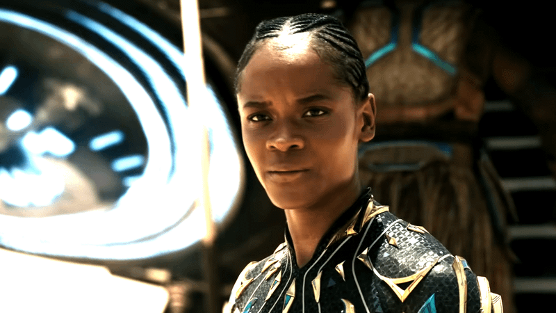 Letitia Wright as Black Panther standing in a desert with a Wakandan behind her in Avengers: Doomsday.