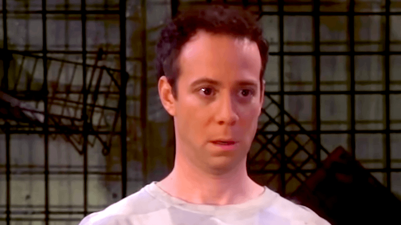 Kevin Sussman as Stuart standing in a broken comic shop in Big Band Theory