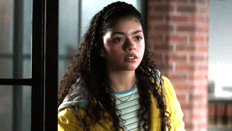 Camila Rodriguez as Angela Del Toro in a yellow jacket in Daredevil: Born Again