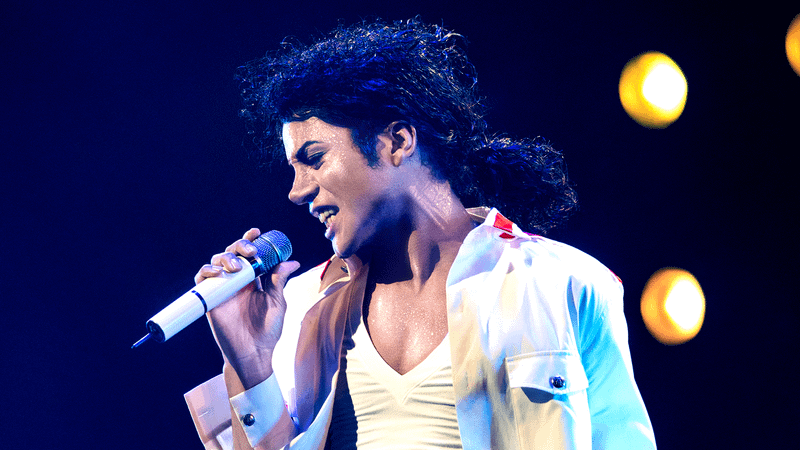 Jafaar Jackson as Michael Jackson singing into a microphone in Michael