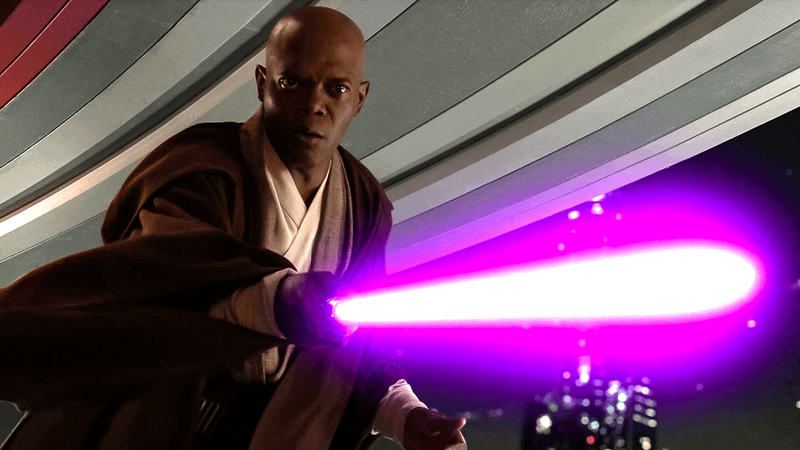 Mace Windu points his unique purple lightsaber.