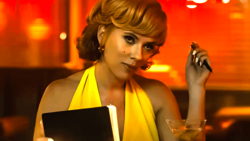 Scarlett Johansson as Kelly Jones clicking a pen in a bar in Fly Me to the Moon.