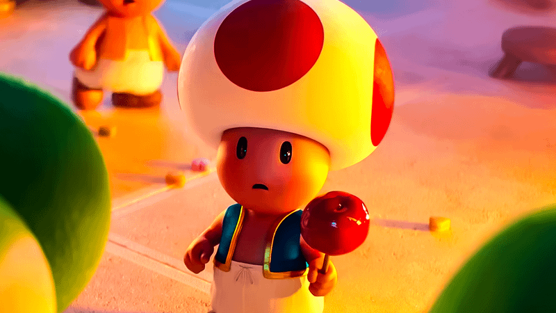 Toad holding up a candy apple in The Super Mario Galaxy Movie.