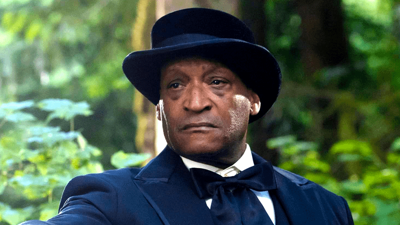 Tony Todd in black suit and top hat