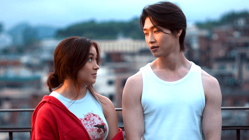 Anna Cathcart's Kitty & Sang Heon Lee's Min-Ho looking at each other in XO Kitty Season 3.