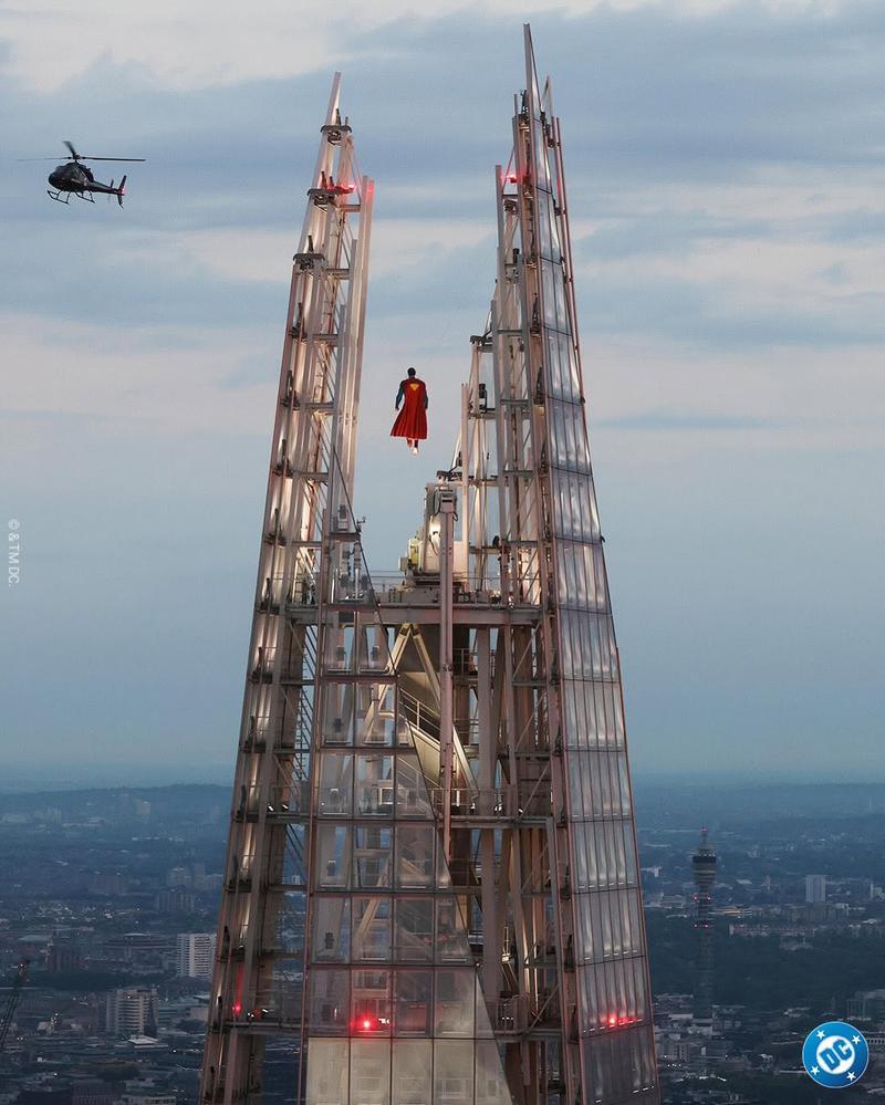 Superman flying over a tall building in Superman