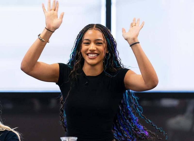 Diaana Babnicova as with her hands in the air.