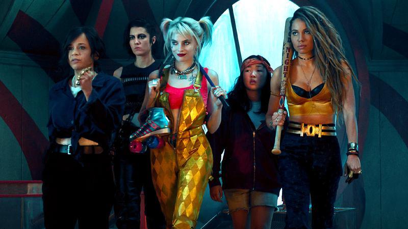 Margot Robbie as Harley Quinn with a group of heroes in Bird of Prey