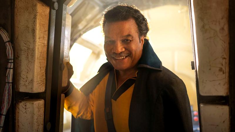 Billy Dee Williams as Lando Calrissian leaning in through a door in Star Wars
