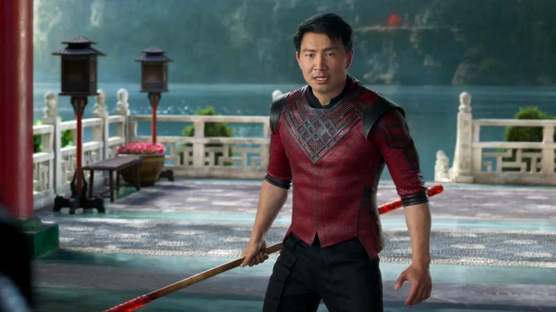 Simu Liu as Shang Chi holding a bo staff in Shang-Chi and the Legend of the Ten Rings