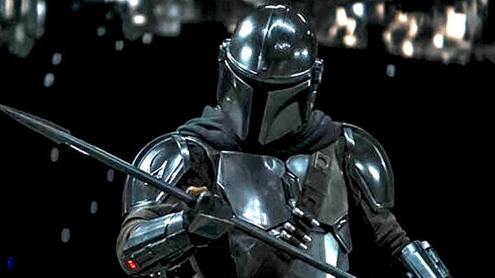 The Mandalorian holding the Beskar spear.
