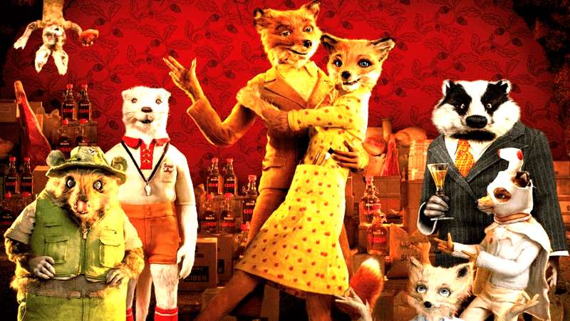 The cast of Fantastic Mr. Fox all standing together with a wallpaper backdrop