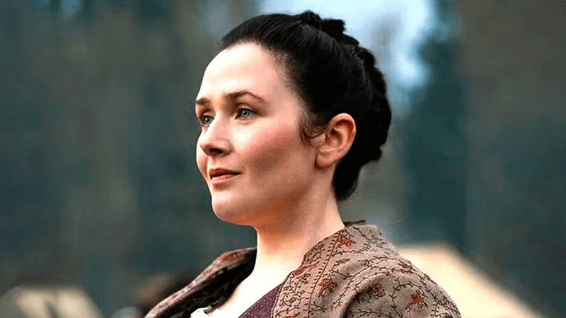 Sadhbh Malin as Jocasta MacKenzie standing in a forest in Outlander: Blood of my Blood